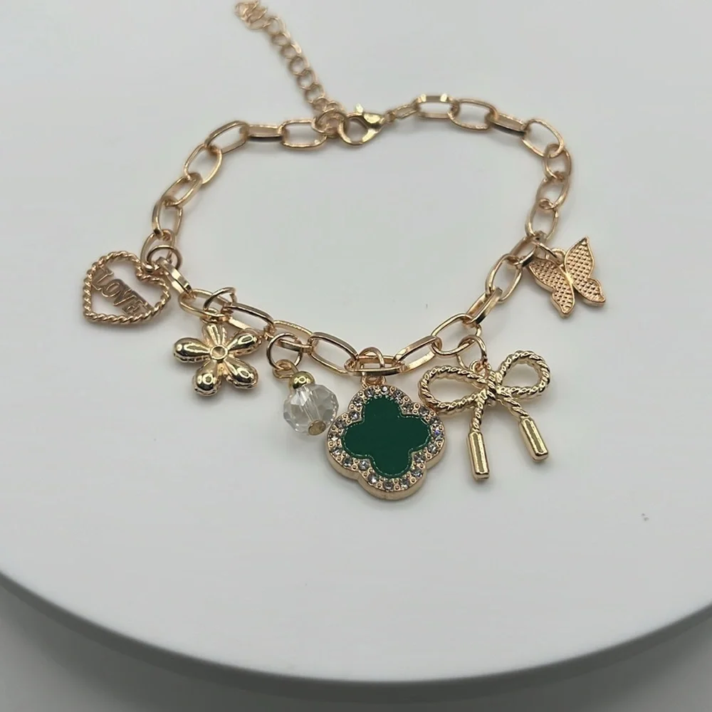 855. Gold Charm Bracelet with Green Clover